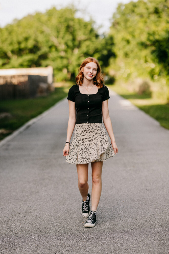 Grace in a cute skirt and black top, capturing her vibrant and playful personality.
