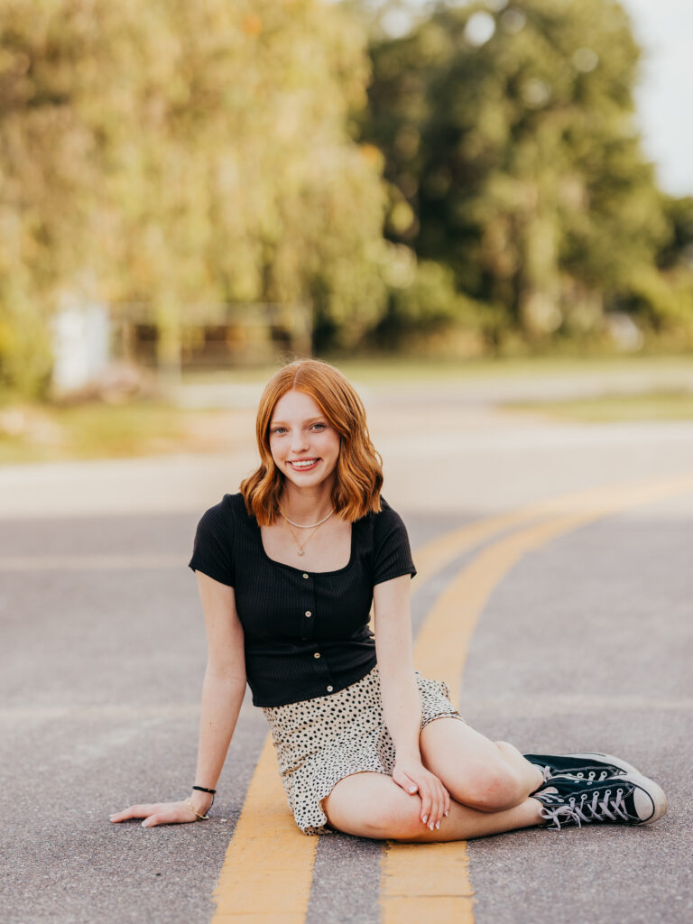 Grace in a cute skirt and black top, capturing her vibrant and playful personality.